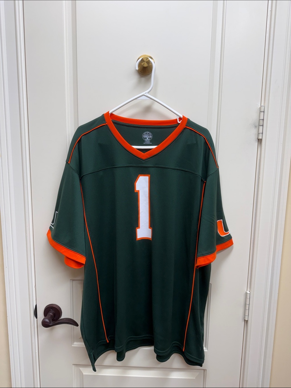 Hurricanes Rivalry Threads Dark Green Jersey with Orange Trim and White Number